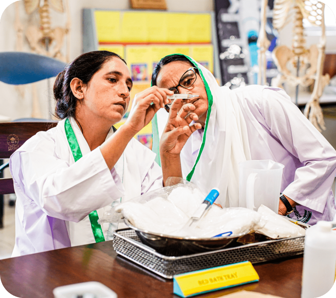 Two women in white lab coats collaborate in a laboratory setting, embodying professionalism and scientific inquiry.